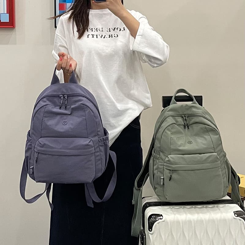 Simples cor sólida nicho Ultra-leve mochila grande capacidade lazer viagem mochila estudante universitário mochila