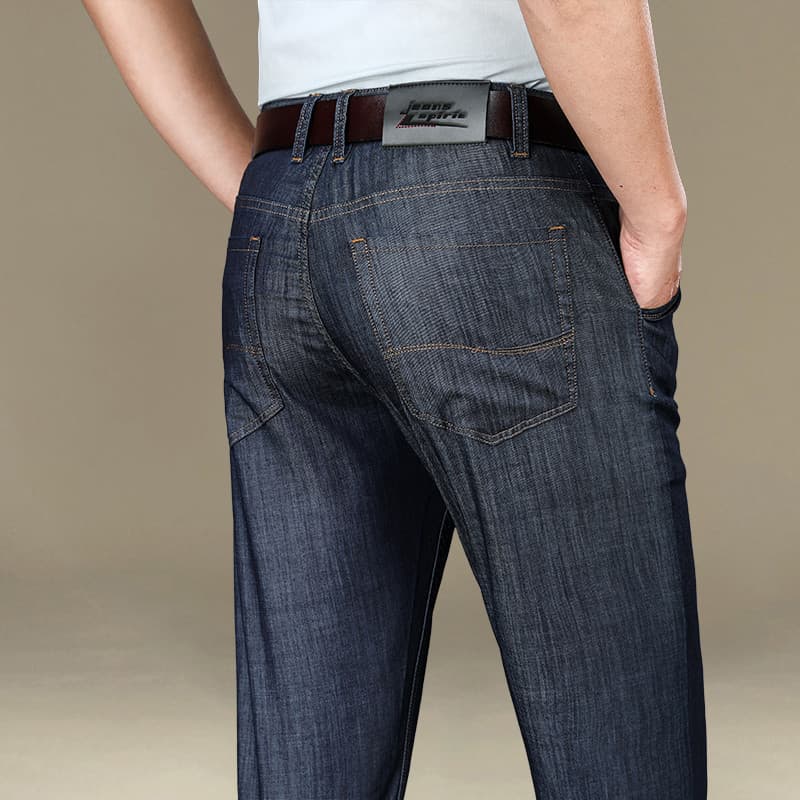 Primavera verão novo estilo Jeans masculino solto tamanho grande elástico em linha reta na moda fino negócios calças cas