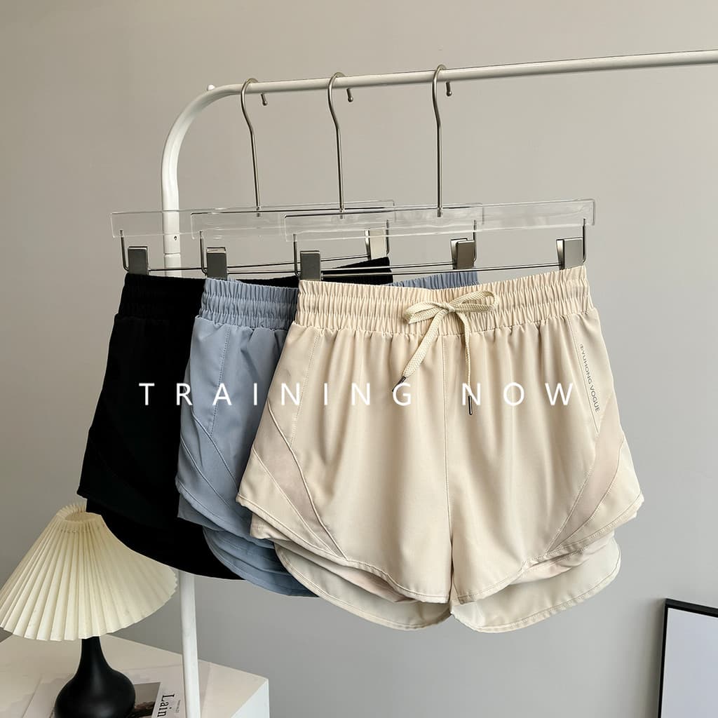 Shorts esportivos femininos verão solto de secagem rápida respirável Yoga calças de três pontos exterior Wear Anti-expos
