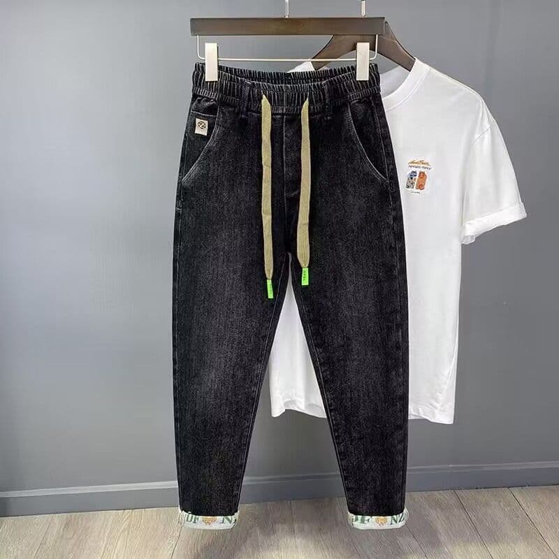 Primavera novo estilo solto estiramento magro comprimento Jeans masculino Street Wear cinto elástico ferro-livre Casual