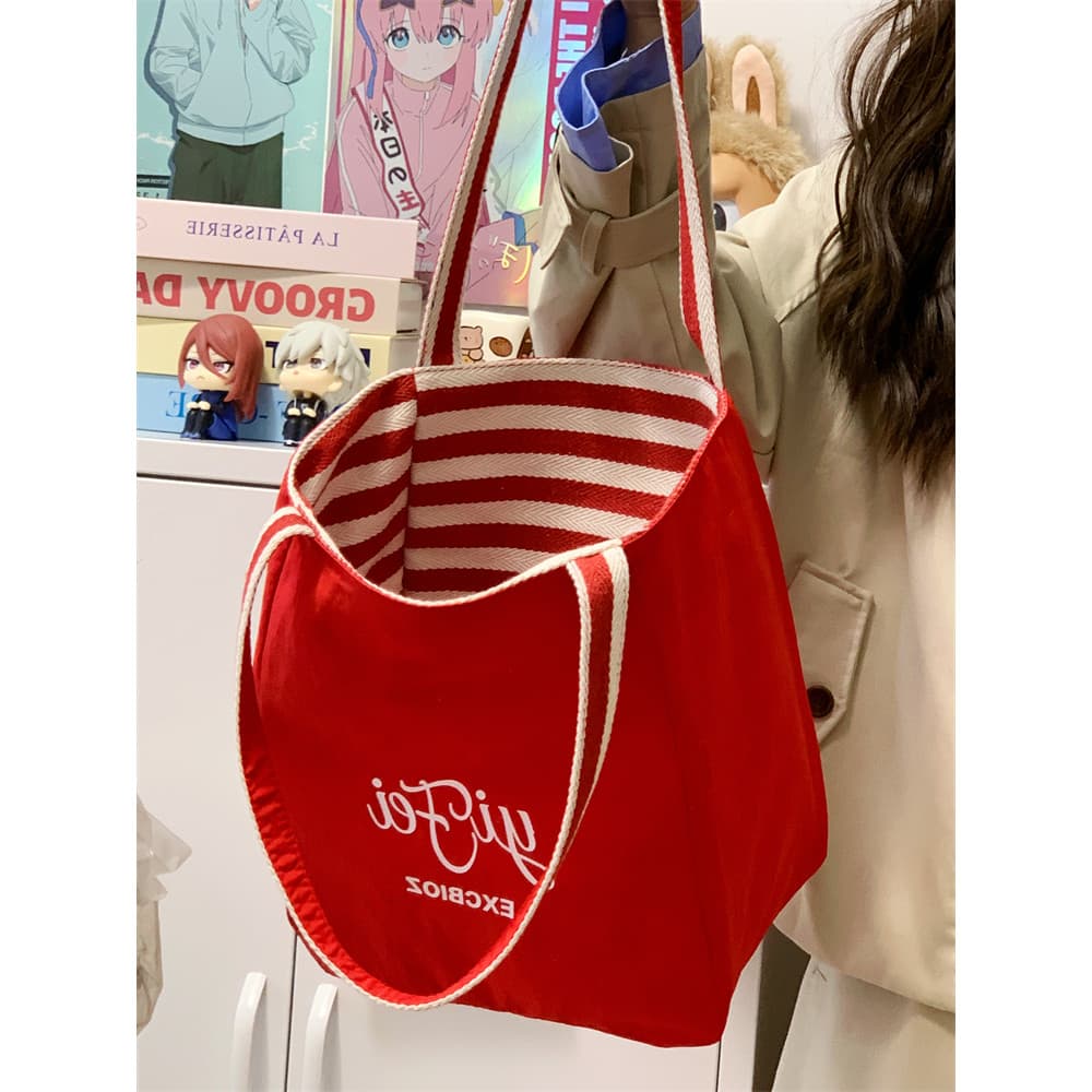 Bolsa de lona vermelha feminina 2026 novo estilo feminino grande capacidade sacola de pano Commuter bolsa de ombro pano