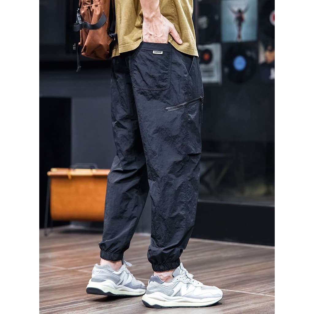 Verão estilo fino de secagem rápida calças casuais masculinas Leggings calças soltas tamanho grande macacão calças mascu