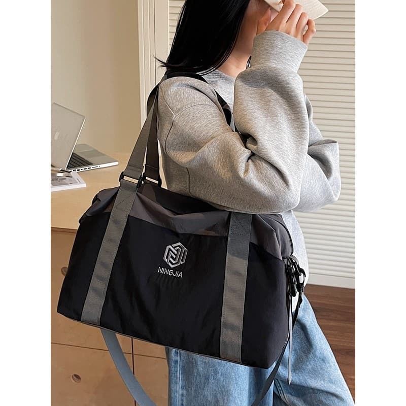 Bolsa de viagem feminina de grande capacidade e alta aparência 2025 novo estilo bolsa de ginástica de curto prazo portát