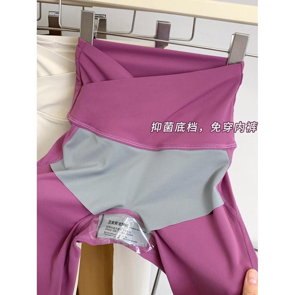 Roupa interior sem desgaste calças de Yoga de alta elasticidade de uma peça moldar nu bolso traseiro pêssego Hip-Lifting