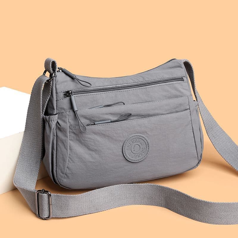 Novo estilo multicamadas leve bolsa mãe de meia-idade 2025 moda feminina bolsa mensageiro bolsa de ombro de grande capac