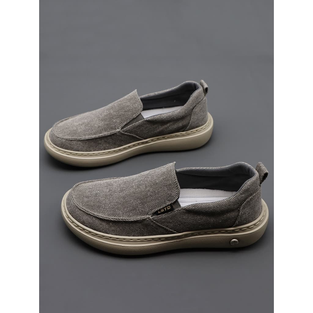 Sapatos de lona masculinos 2026 primavera outono novo estilo respirável plana tênis casuais de cano baixo deslizamento e