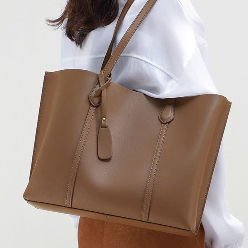 Bolsa feminina francesa MKDN 2026 novo estilo bolsa de viagem bolsa de grande capacidade bolsa de couro