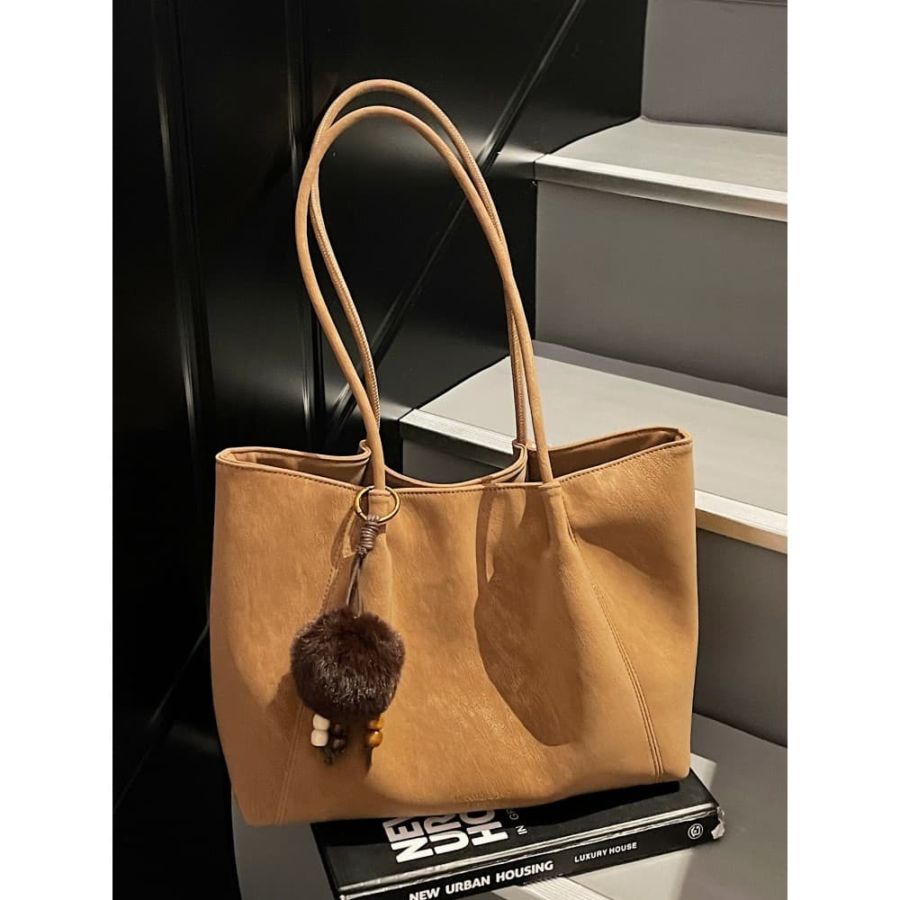 Simples sacola feminina grande capacidade portátil bolsa de ombro 2025 Casual versão coreana novo estilo All-Match Commu