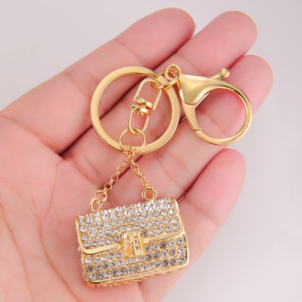 Pingente de bolsa pequeno com strass exclusivo, chaveiro de liga leve e luxuosa.