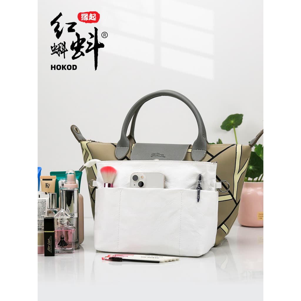Tadpole vermelho Guangzhou grande capacidade portátil portátil amassar padrão Dupont saco de papel em saco saco de cosmé