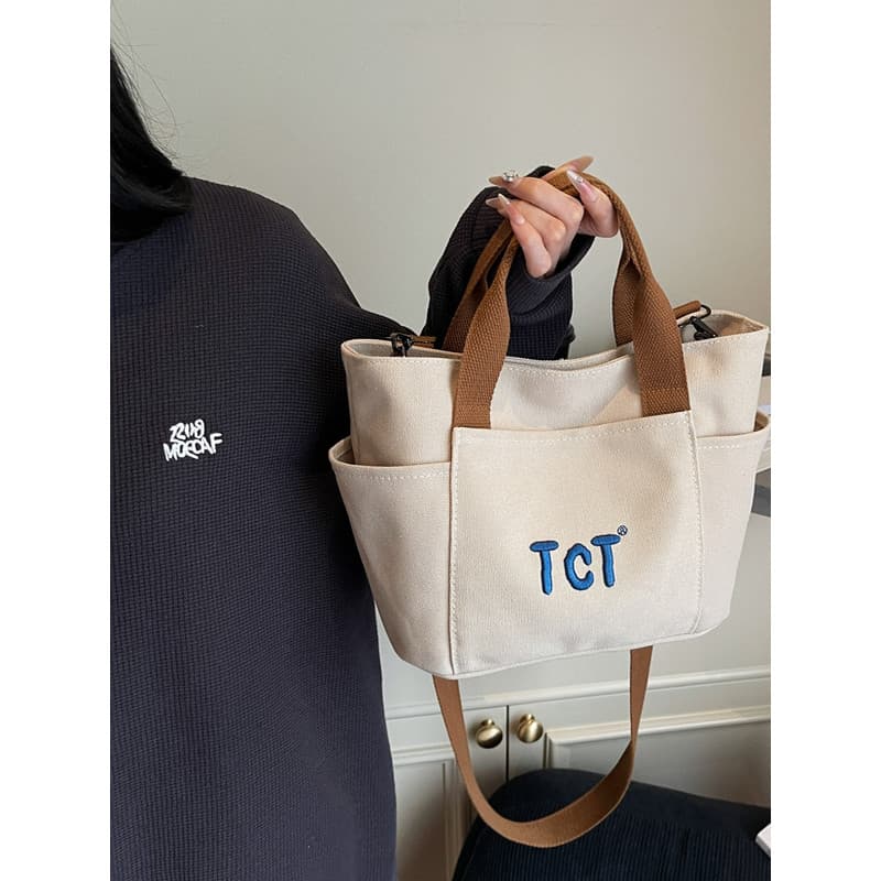 Novo estilo bolsa de lona Super quente trabalho artigos diversos pequena bolsa Casual Commuter para fora chave saco do m