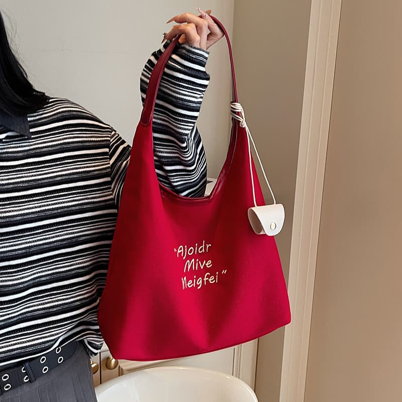 Super quente vermelho grande capacidade bolsa de lona feminina 2025 novo estilo Casual um ombro axilas saco All-Match Co