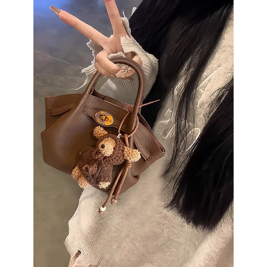 Inverno Retro portátil balde saco feminino 2026 novo estilo luz luxo nicho Design High-End Commuter saco do mensageiro