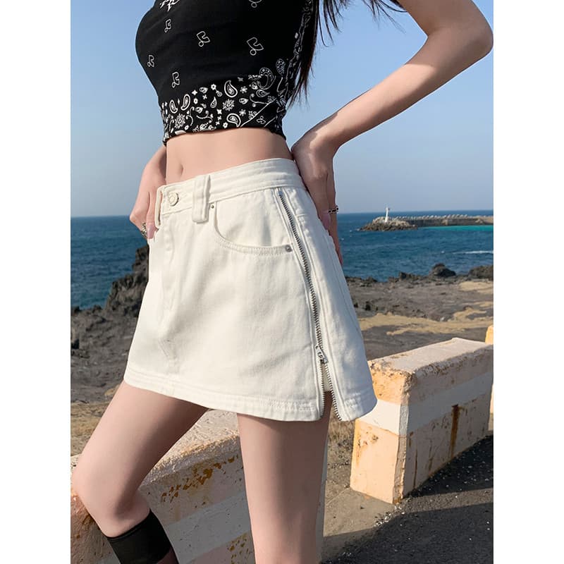 Design lateral zíper branco Denim saia feminina 2026 primavera verão cintura baixa mais magro olhar americano quente men