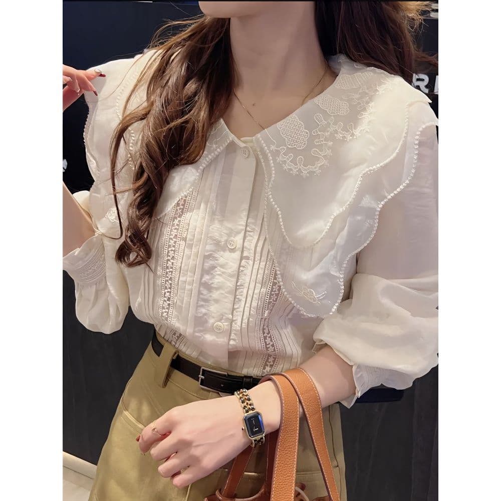 Camisa de manga comprida com gola de boneca francesa feminina primavera novo estilo Design nicho moda moda renda costura