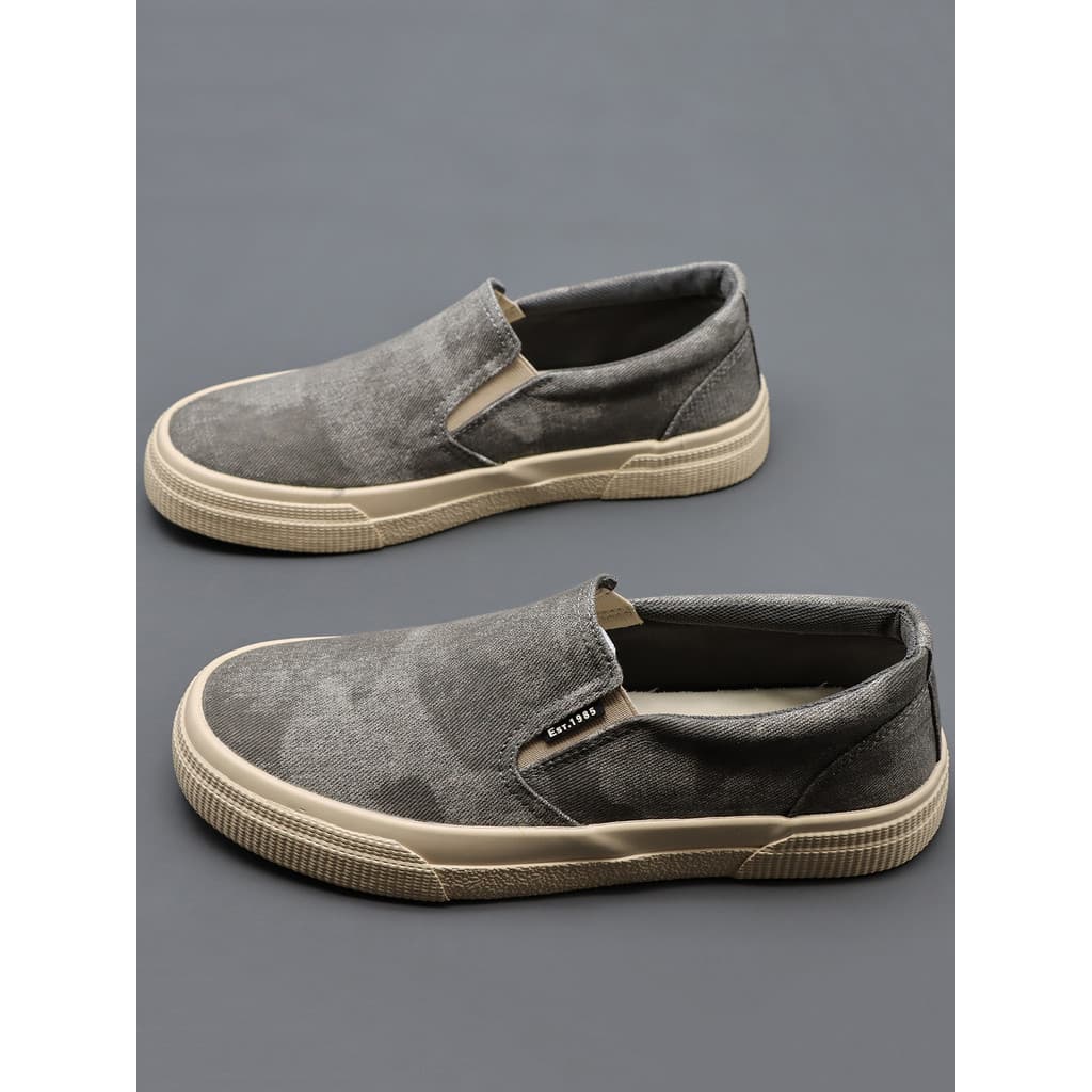 2026 primavera novo estilo respirável sapatos de lona masculino Casual na moda tênis de cano baixo deslizamento em mocas