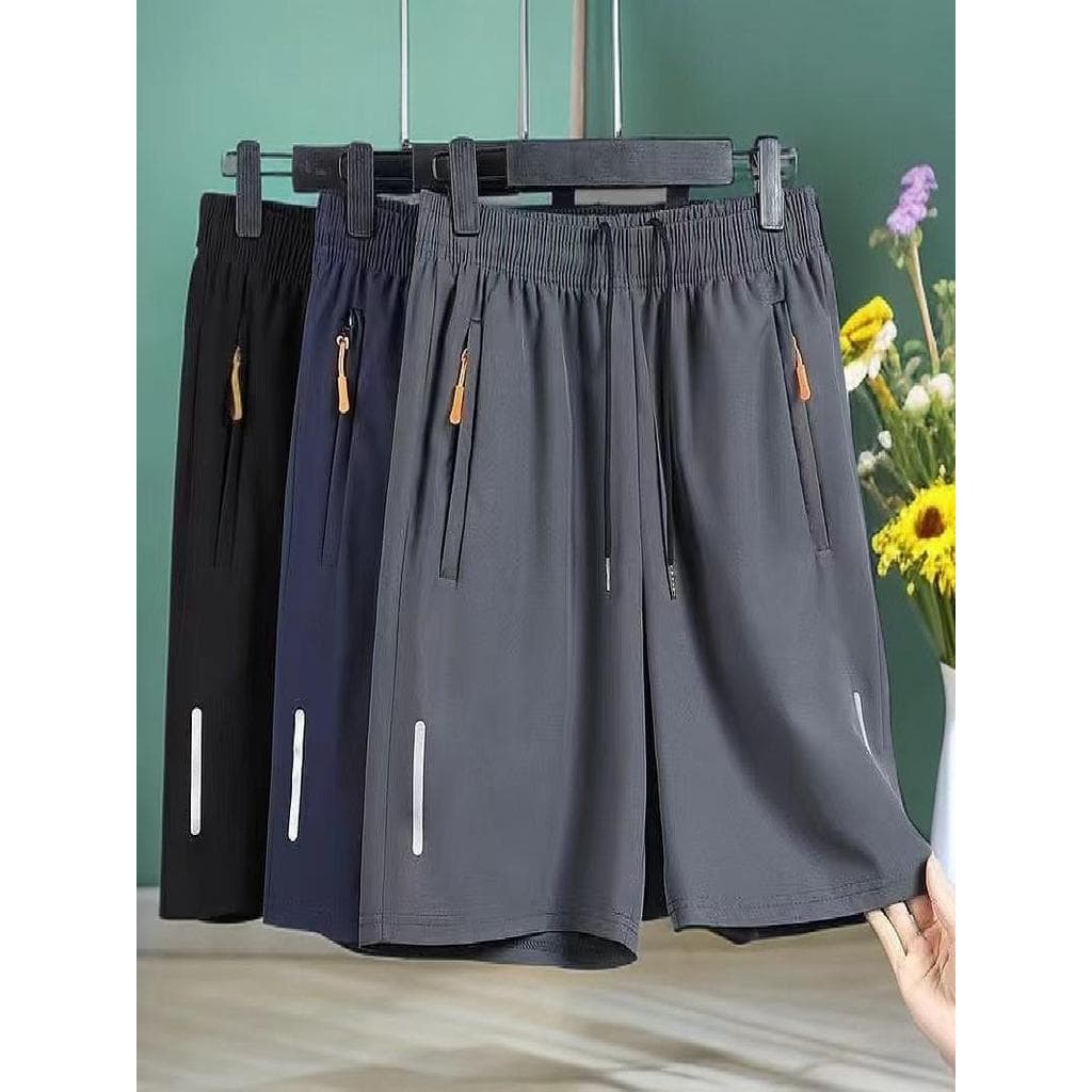 Verão masculino de secagem rápida Casual zíper shorts masculino correndo shorts esportivos soltos calças de cinco pontos