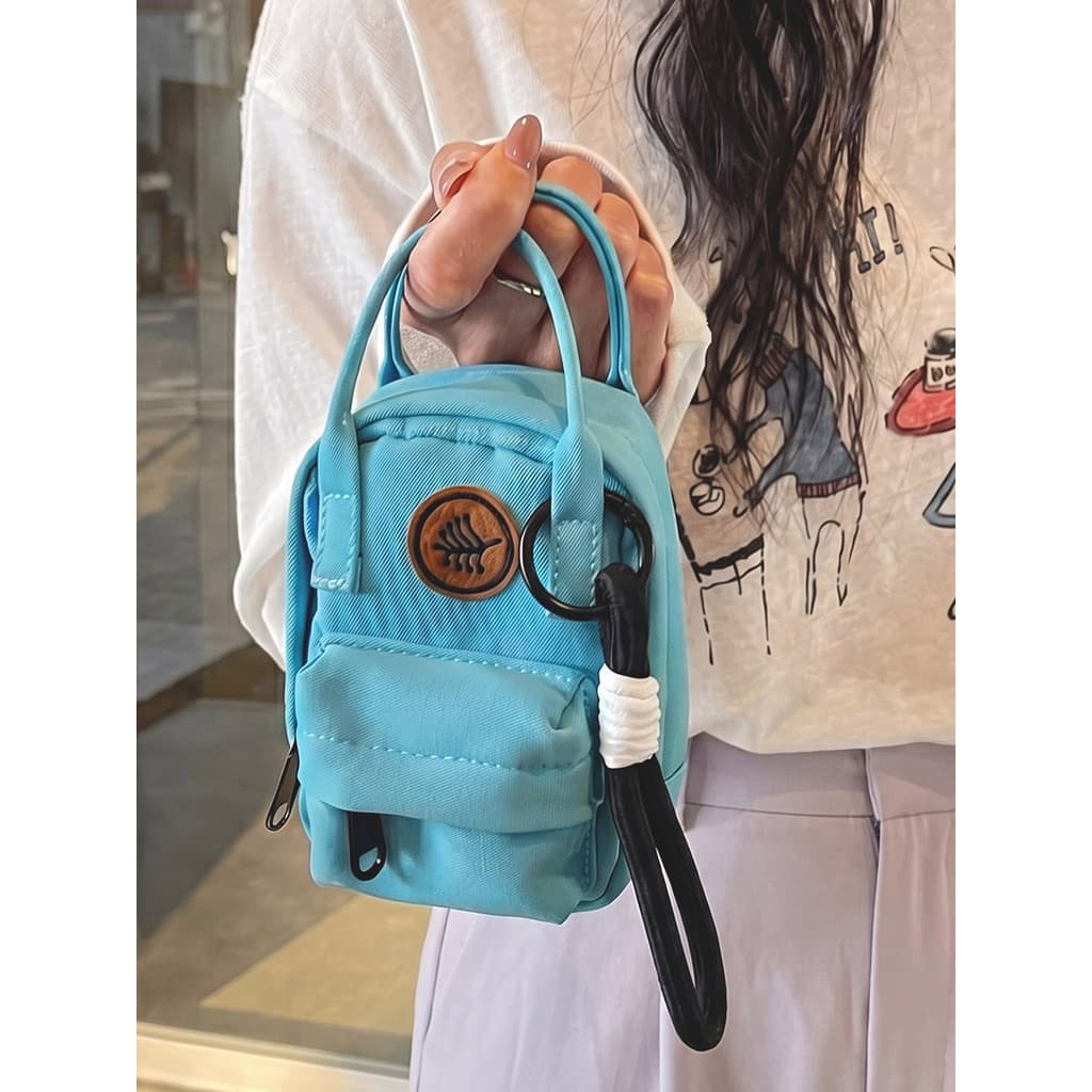 Leve Mini pequeno saco feminino 2026 novo estilo portátil fone de ouvido saco ornamentos de viagem mão-transporte chave