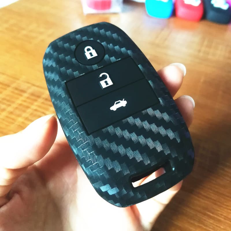 Adequado para Kia chave capa k2 Xinzhi correndo k4 leão correndo Freddy Ao correndo kx3K5 padrão de carbono Silicone res