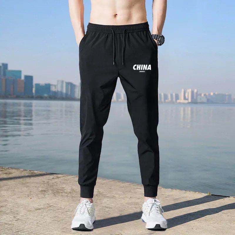 Macacão masculino calças soltas resistentes ao desgaste forte 20 Yuan calças masculinas canteiro de obras calças de trab