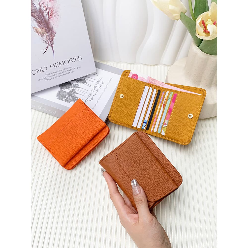 Estilo ultrafino 2026 novo estilo de couro genuíno estilo curto carteira dobrável feminina All-Match bolsa de moedas de