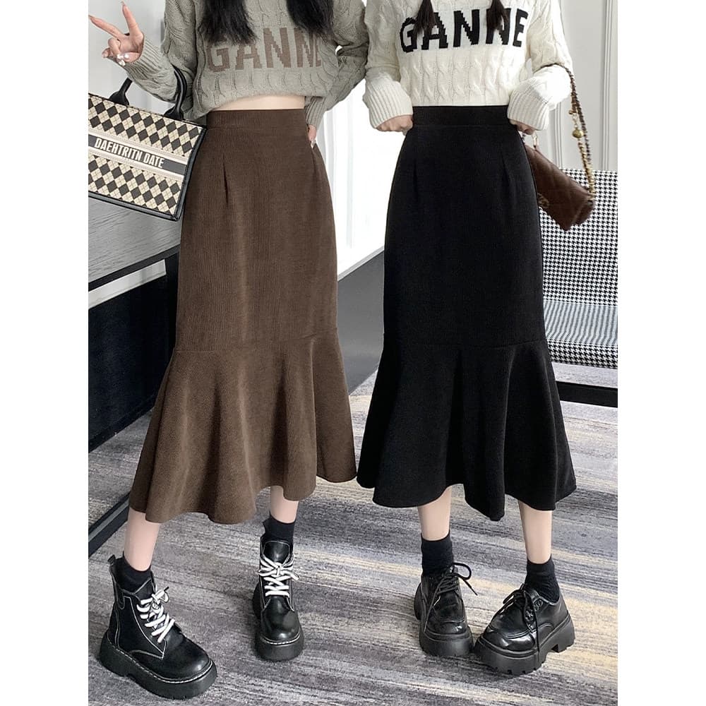 Preto Fishtail saia feminina outono inverno 2026 novo estilo cintura alta Hip saia de comprimento médio A linha saia mei