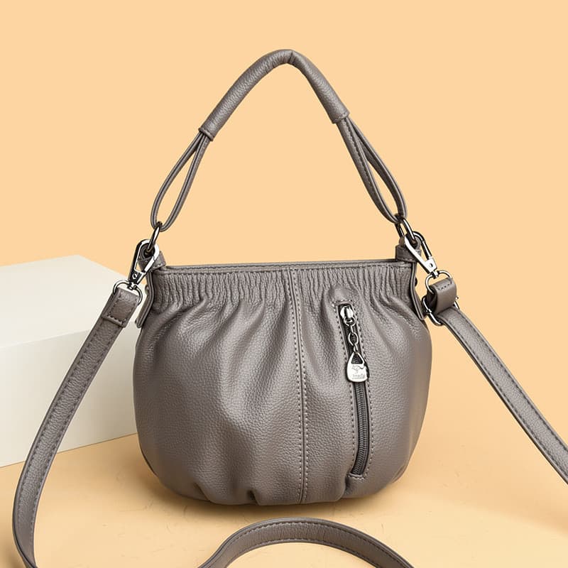 Bolsa pequena simples e elegante com um toque moderno e estiloso, popular bolsa versátil tipo bucket para mulheres, novo