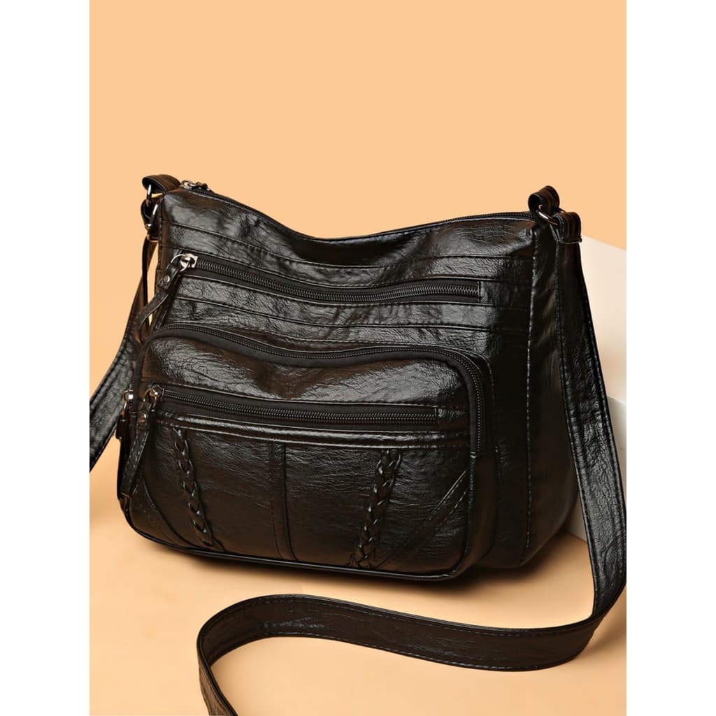 Bolsa Crossbody preta antirroubo com feixe de tração de cor sólida