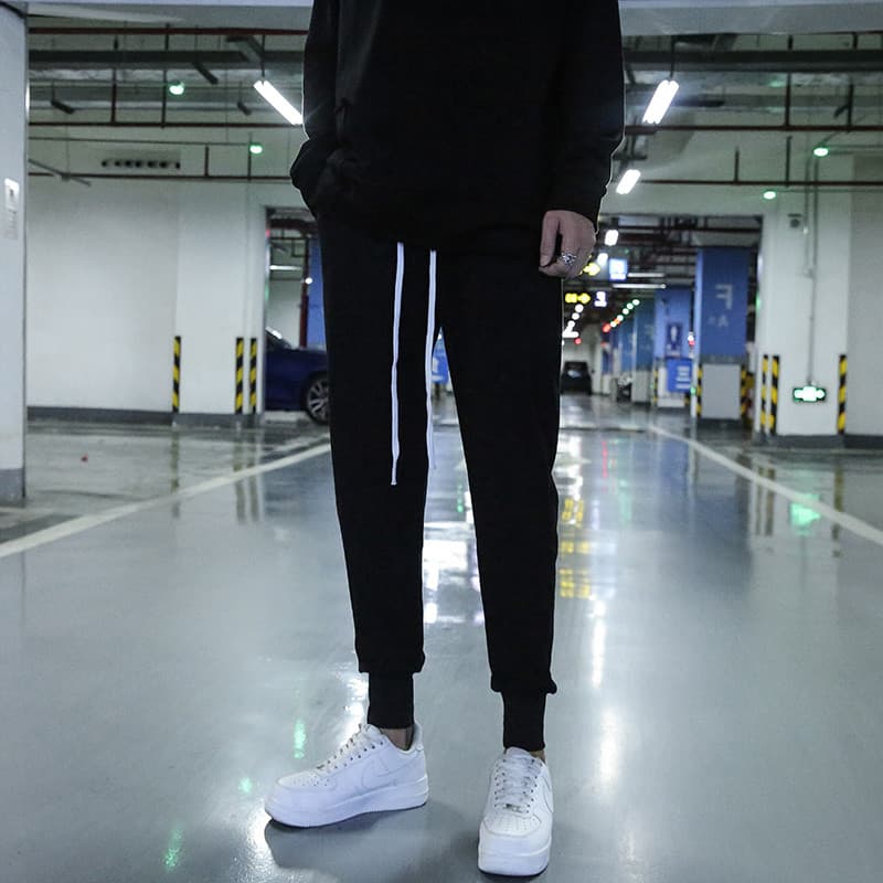 Calças esportivas casuais de rua alta calças masculinas ajuste fino na moda elástico street Wear Harem calças preto com