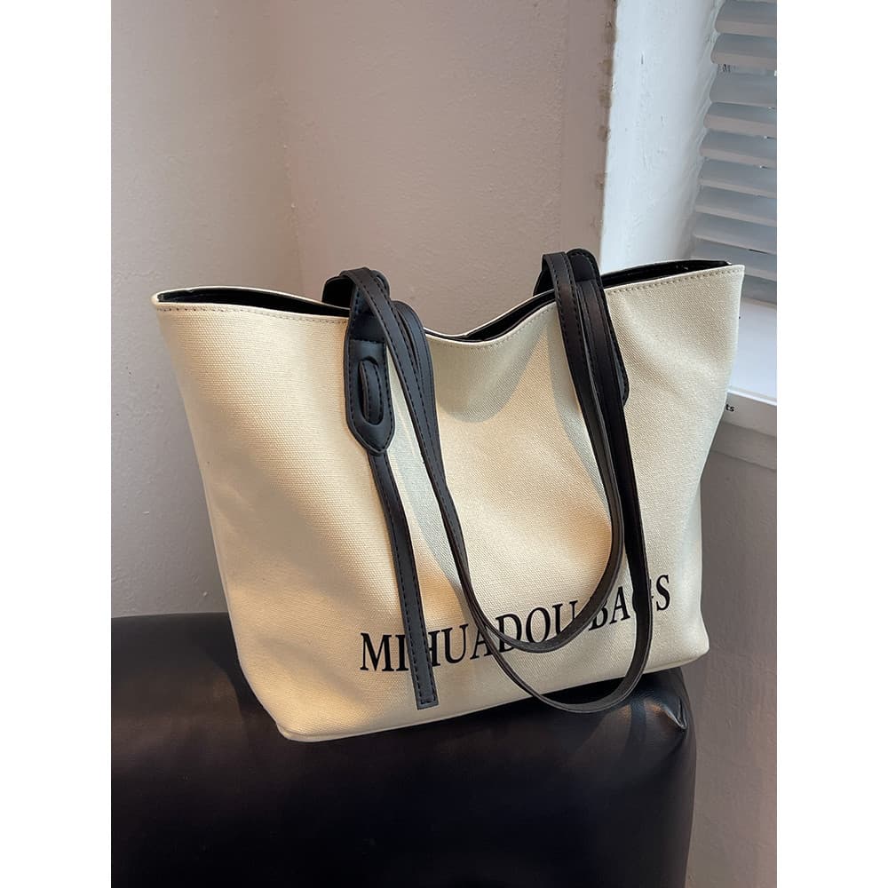 Bolsa de lona francesa feminina 2026 novo estilo grande capacidade trabalho Commuter bolsa de ombro portátil High-End sa