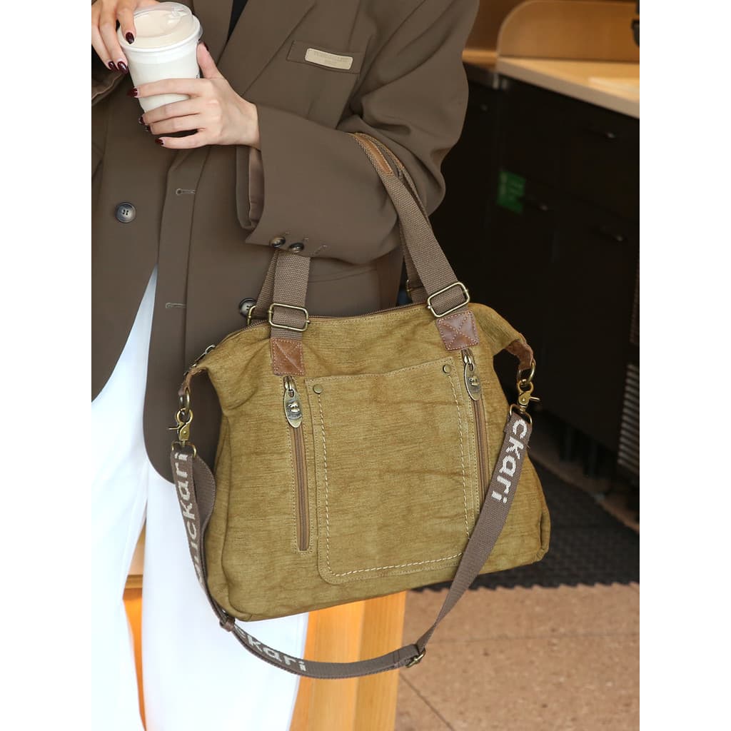 Bolsa Tote feminina de grande capacidade 2026 outono novo estilo bolsa de lona Commuter bolsa de ombro Design nicho
