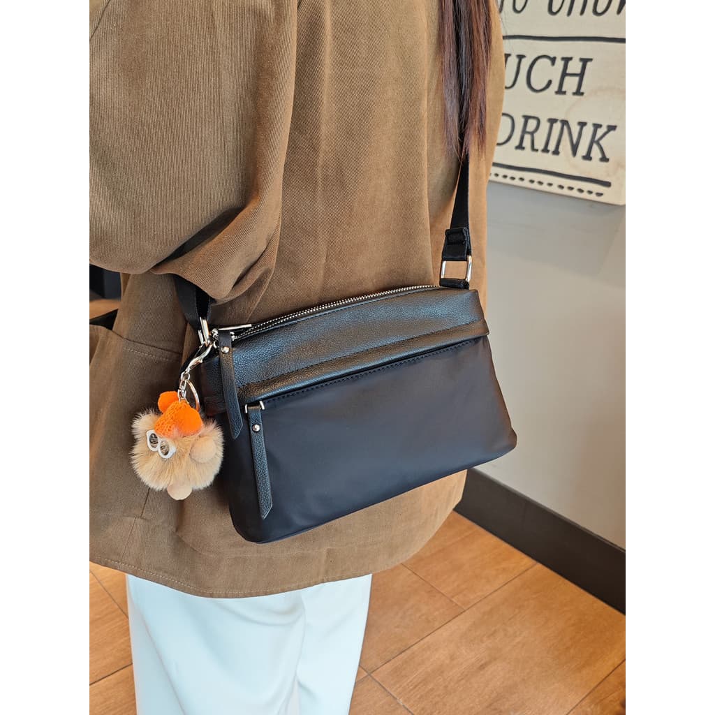 Primeira camada de couro com bolsa de pano Oxford bolsa mensageiro feminina 2026 novo estilo moda Multi-compartimento di