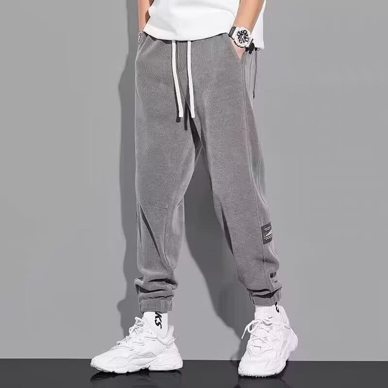 Fabricantes de fonte calças soltas masculinas outono novo estilo calças casuais Street Wear calças com cordão adolescent