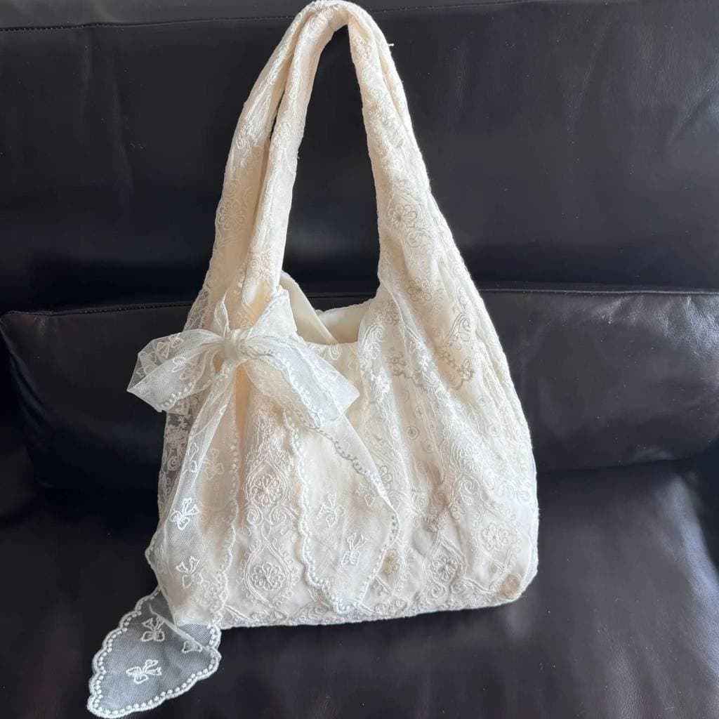 Estilo coreano fresco laço flor bolsa de lona feminina 2026 novo estilo grande capacidade de um ombro sacola Commuter ax