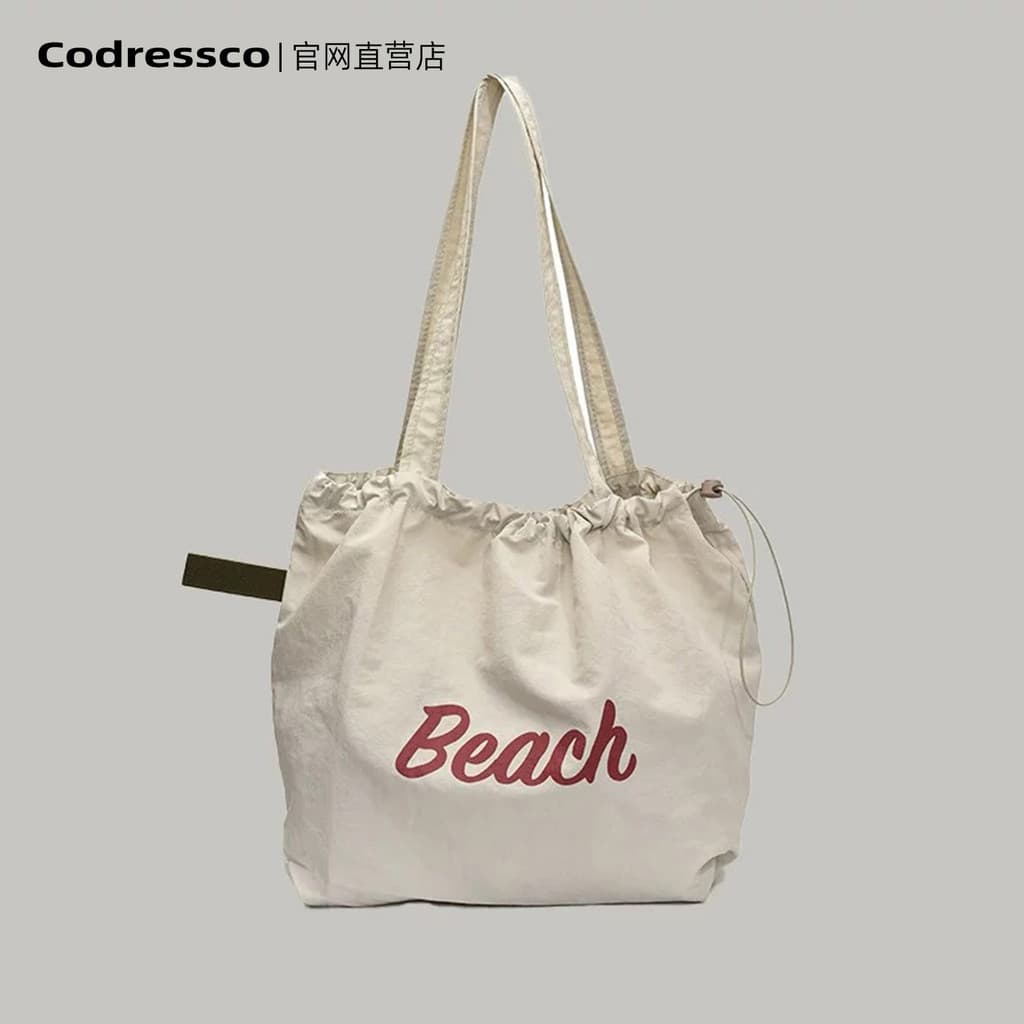 Bolsa feminina versão coreana 2025 novo estilo leve Casual All-Match cordão grande capacidade bolsa de ombro computador
