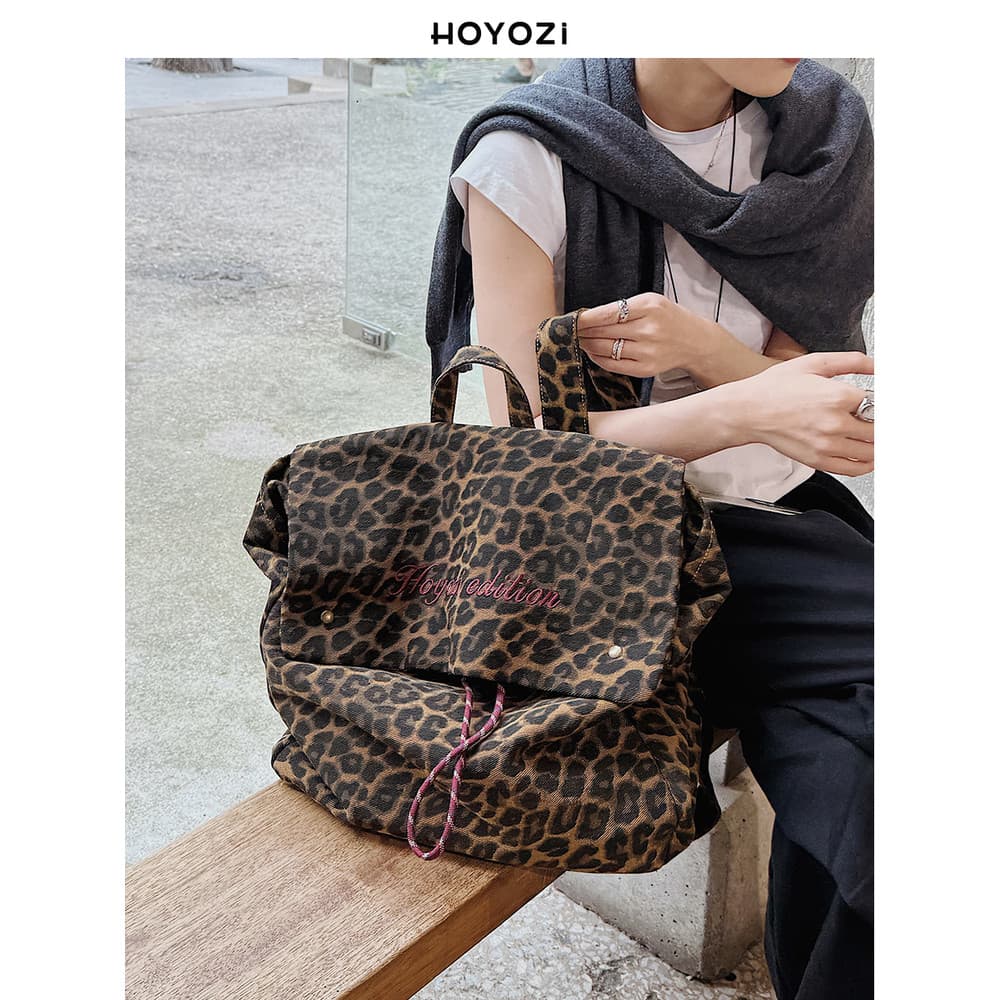 [Bolsa Xiaoyoujia] HOYOZI Mochila de lona com estampa de leopardo coreana Mochila feminina de grande capacidade 2026 Nov