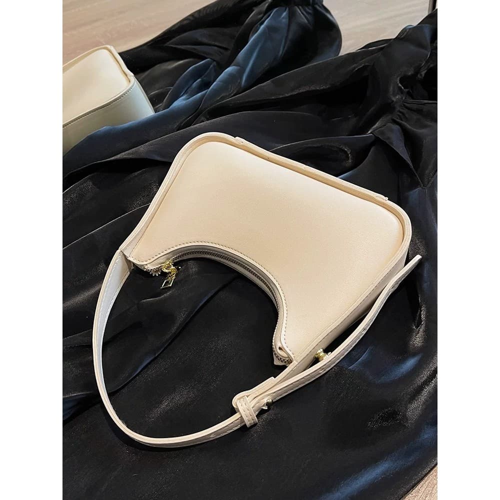Bolsa de nicho de alta qualidade feminina 2026 All-Match francês portátil branco bolsa de ombro baguete axila