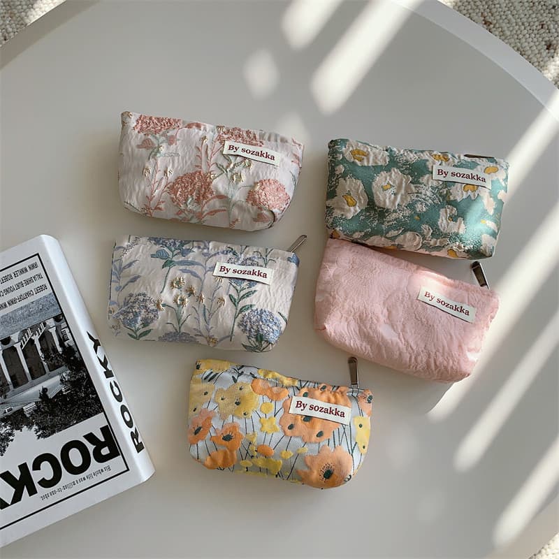 2026 novo estilo Jacquard High-End tamanho pequeno saco cosmético feminino Mini batom saco portátil artigos diversos moe