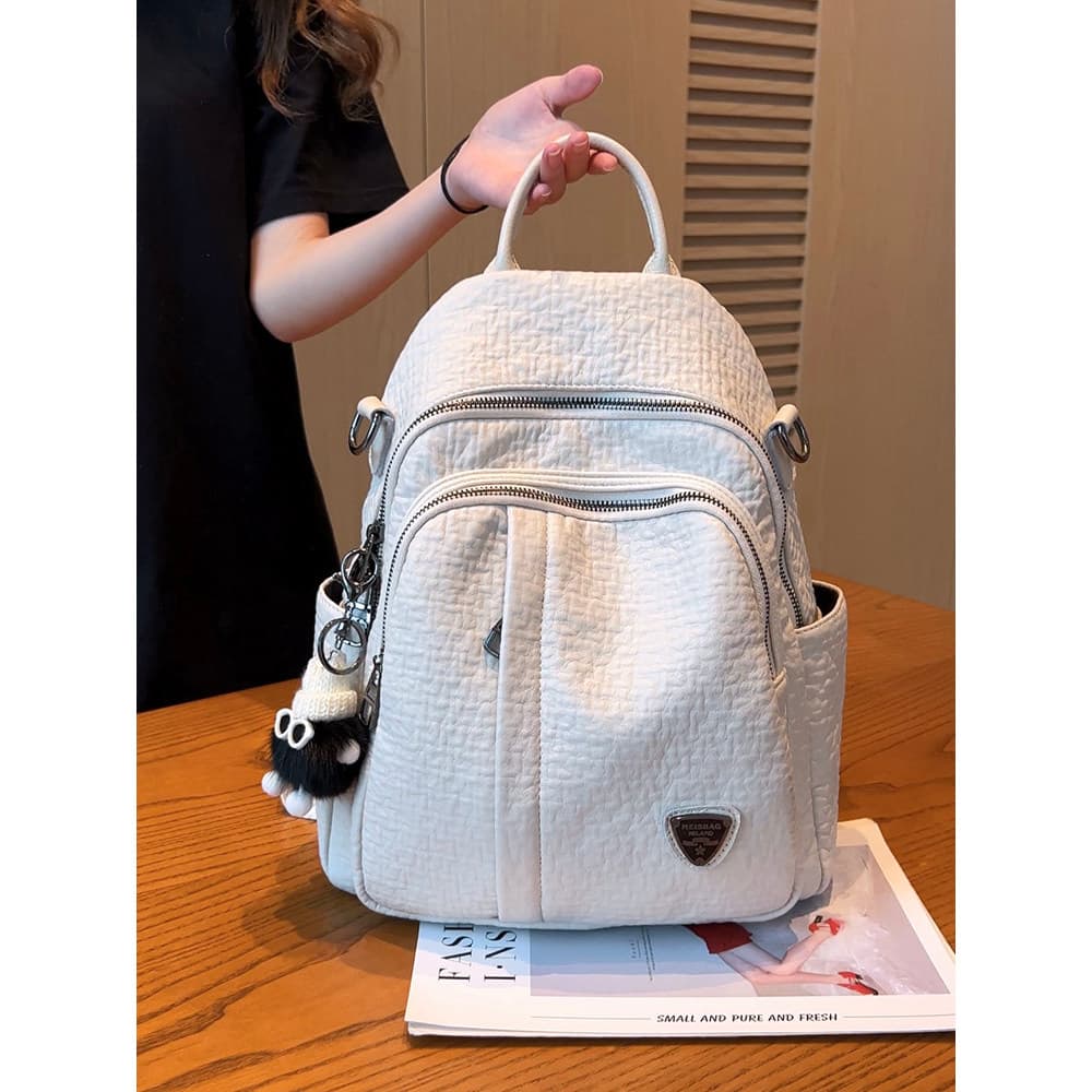2026 novo estilo primavera verão branco couro genuíno mochila feminina Multi-bolso lazer viagem mochila moda All-match b