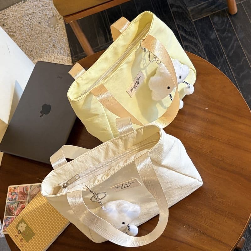 Bolsa fofa 2026 novo estilo bolsa feminina japonesa simples cosmética Mini trabalho Commuter bolsa Casual