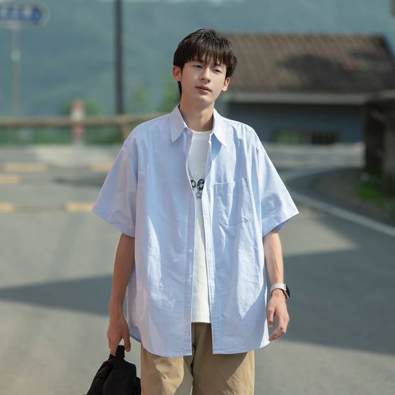 Camisa de manga curta masculina verão novo estilo solto High-End lapela camisa azul claro Casual jaqueta solta