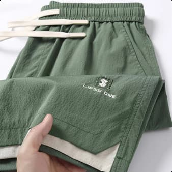 Shorts masculinos verão 2026 novo estilo Street wear exterior wear Casual esportes gelo seda estilo fino calças de cinco