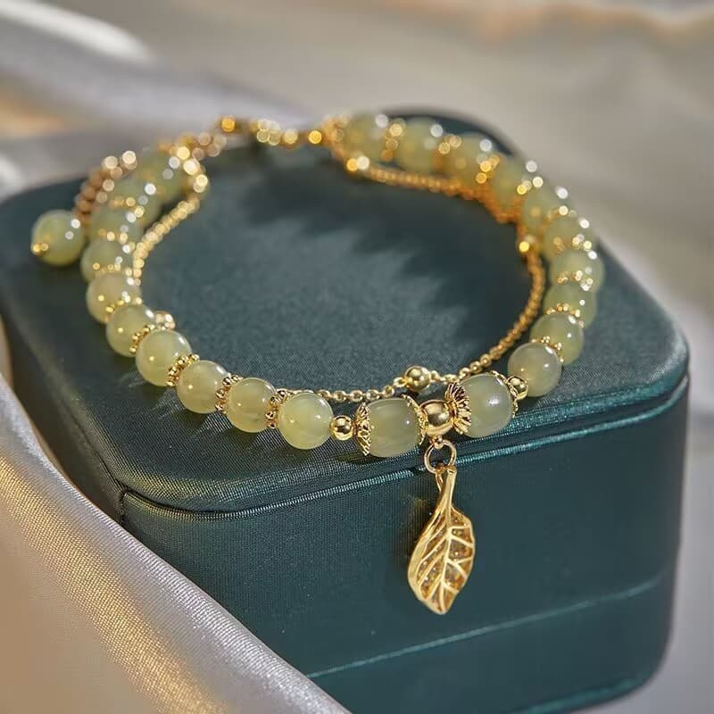 Pulseira de imitação de jade Hetian para o Dia dos Namorados Qixi, presente de alto padrão, com ramo dourado e folha de