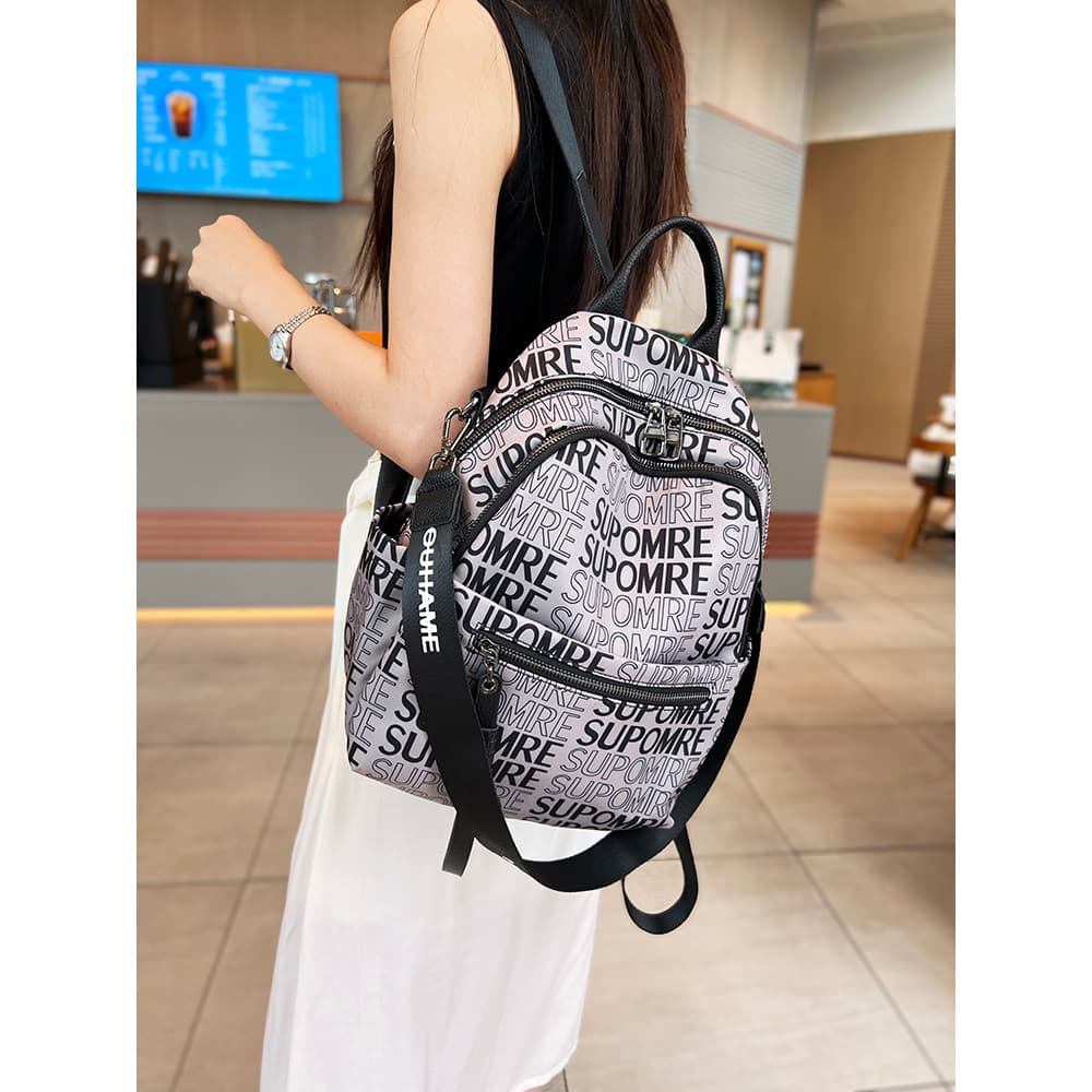 Impresso na moda mochila feminina 2025 novo estilo Oxford pano leve Multi-bolso mochila de náilon de um ombro dupla util