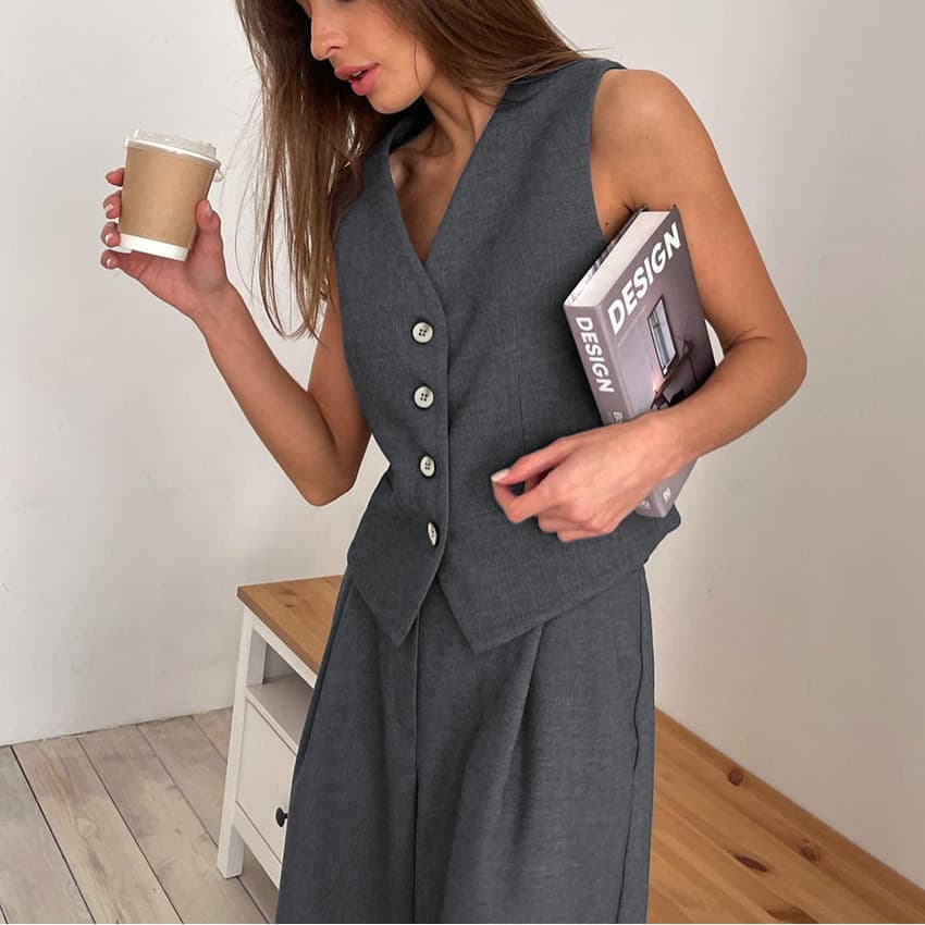 Conjunto minimalista popular de duas peças para o trabalho, composto por colete sem mangas com decote em V e calças de a