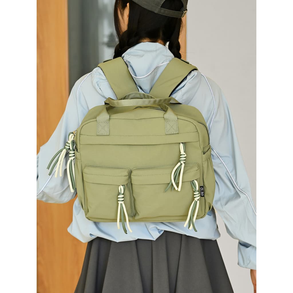 Mochila feminina 2026 novo estilo cor sólida lazer ao ar livre portátil dupla utilização pequena mochila Multi-bolso est