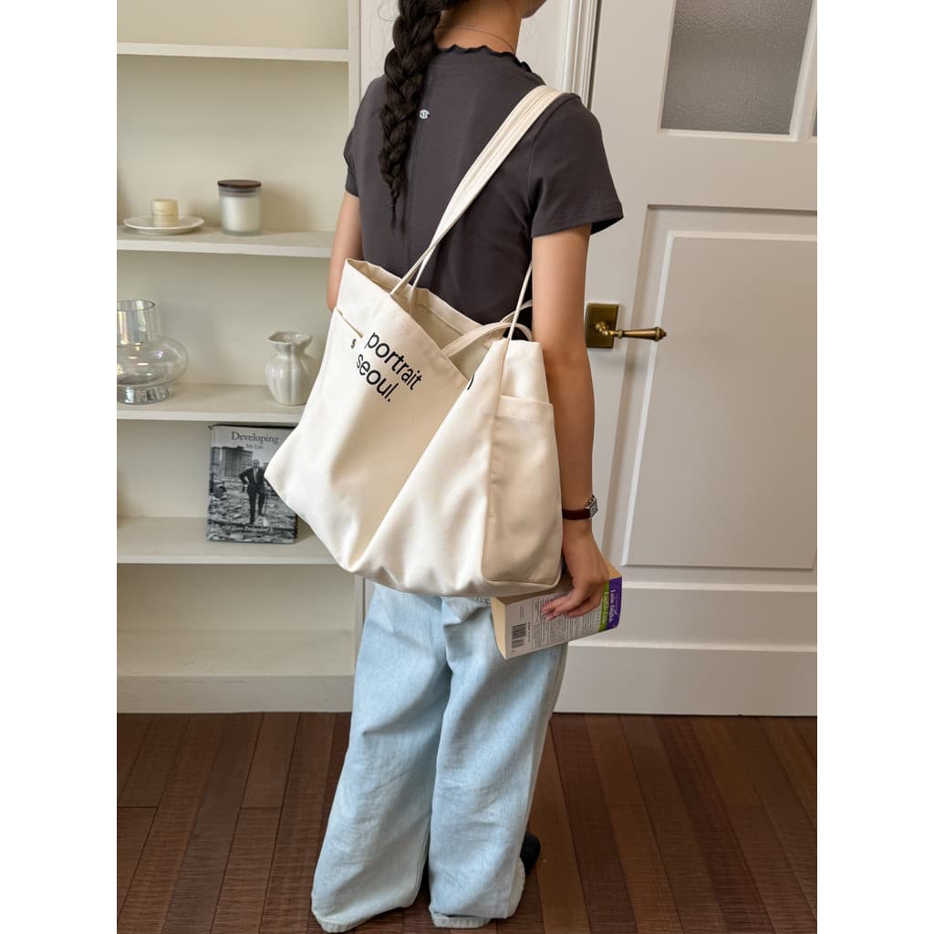 Bolsa de lona de grande capacidade estilo coreano ins2026 novo estilo sensação solta bolsa de pano de mão estudantes uni