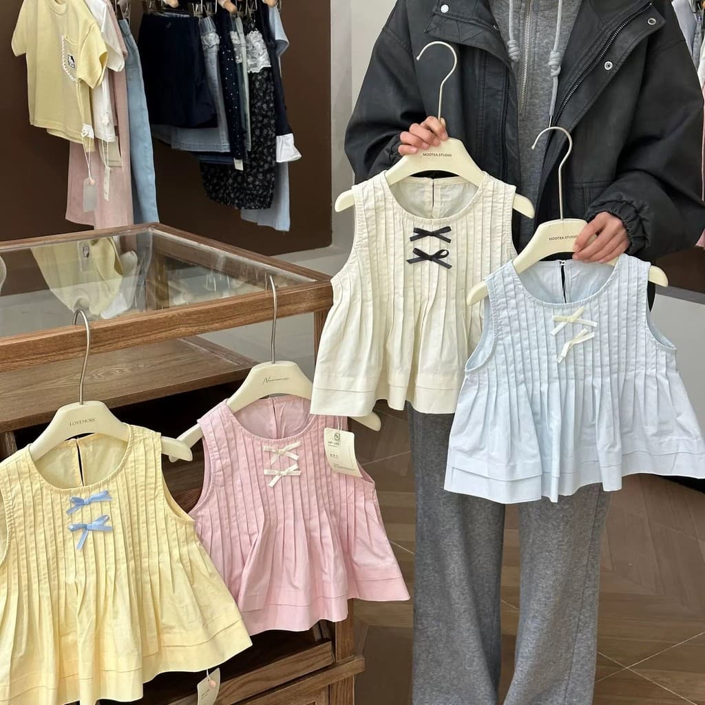 Meninas camisa do bebê 2026 verão versão coreana All-Match Casual estilo ocidental arco nó plissado sem mangas camisa to