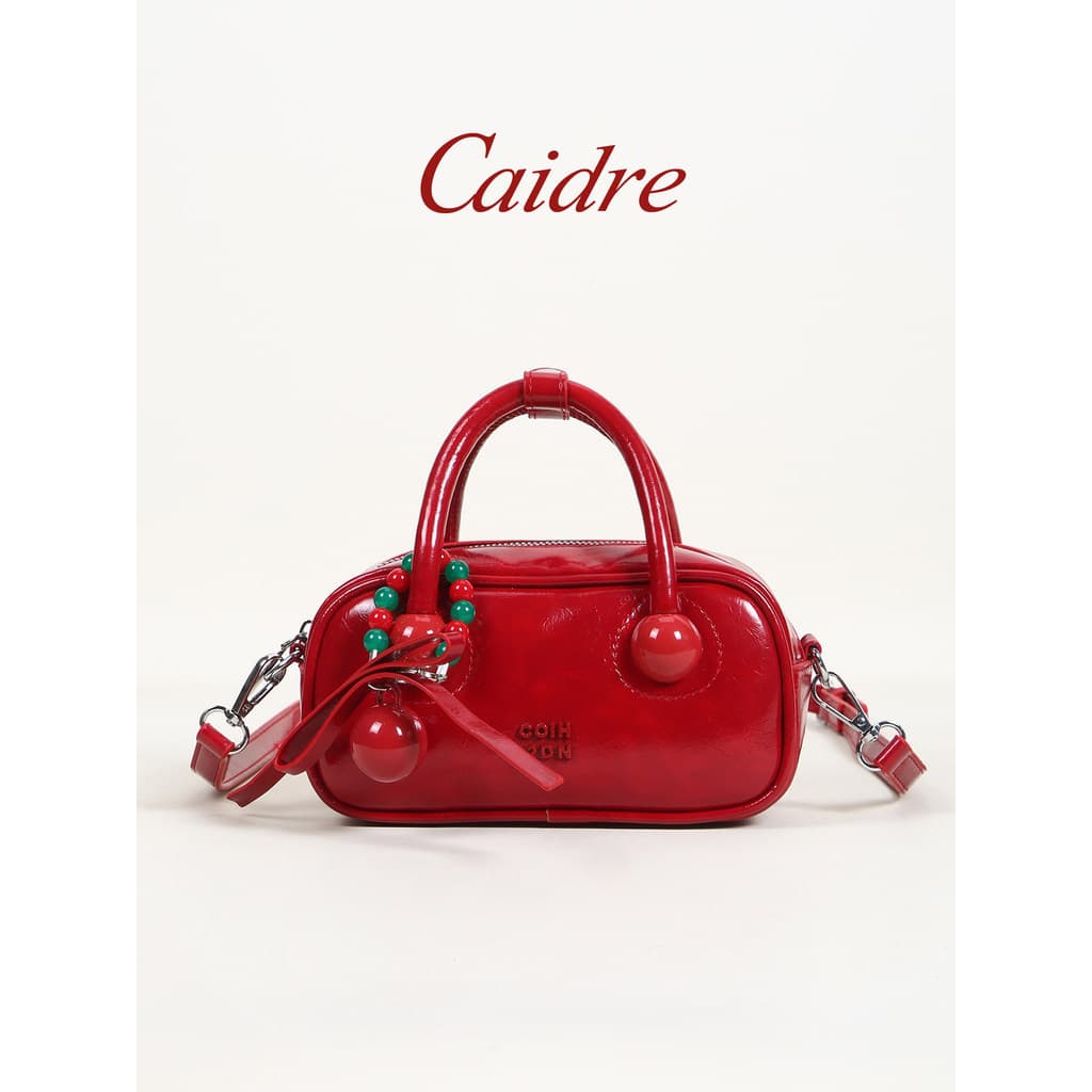 bolsa feminina Bolsa Caidre Red Bowling Bag Feminino 2026 Novo Estilo Commuter Portátil Travesseiro Bolsa Nicho Bolsa Me