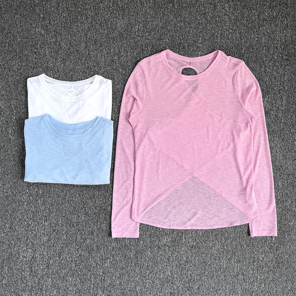 Novo estilo esportivo de manga comprida feminino solto respirável protetor solar blusa oco bonito volta cruz bainha Yoga